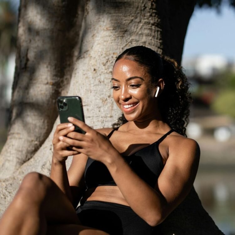 Woman smiling while texting