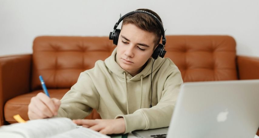 Student studying while listening to Music