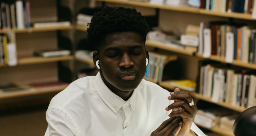 Student listening on His Wireless Earphones