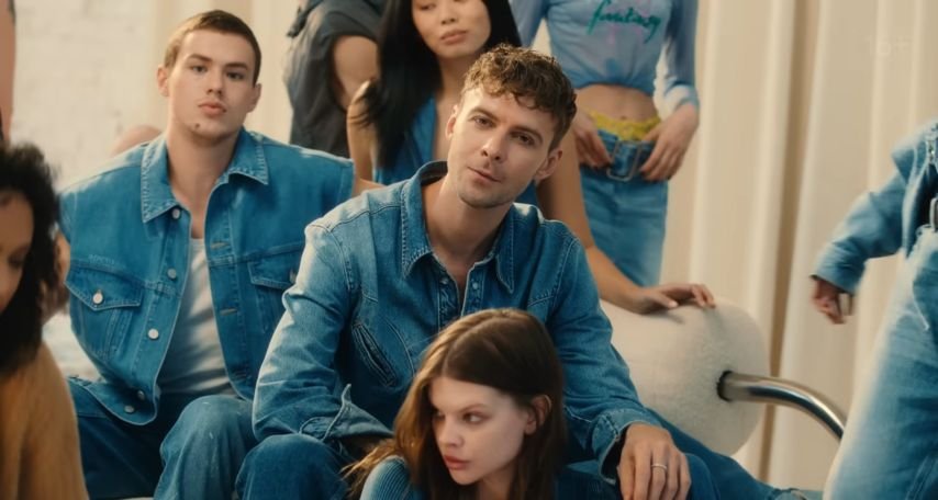 Group of young adults with Max Barskih in the Stomach Butterflies music video