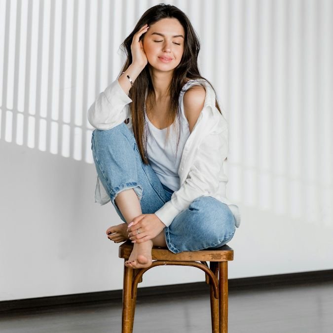 Smiling Woman is Sitting on Chair
