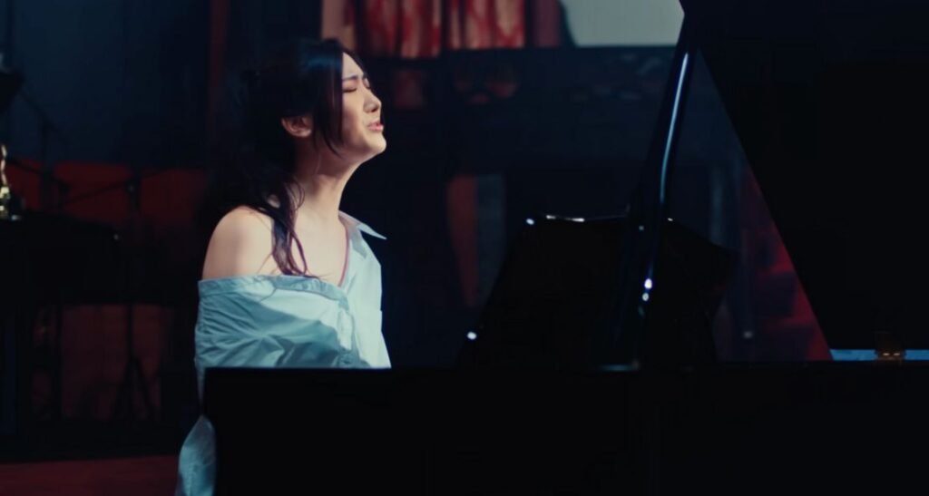 EJAE Steps Into the Spotlight With "In Another World": A Songwriter's Confession