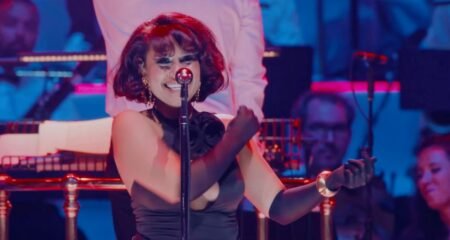 RAYE Elevates Escapism with Orchestral Brilliance