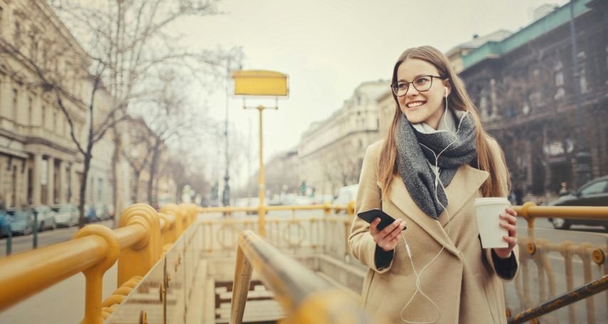 Solo traveler walking through a city during the holiday season